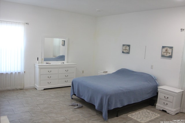 bedroom featuring multiple windows