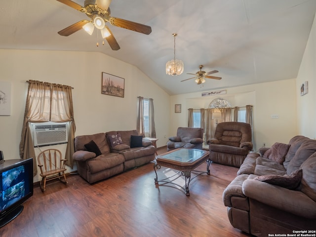 living room with ceiling fan with notable chandelier, cooling unit, vaulted ceiling, and dark hardwood / wood-style flooring