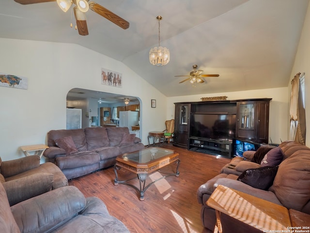 living room featuring ceiling fan with notable chandelier, vaulted ceiling, and dark hardwood / wood-style flooring