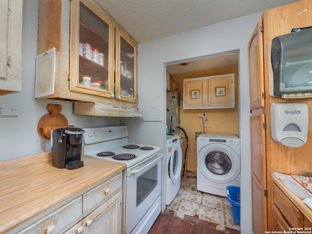 kitchen with electric stove, separate washer and dryer, a textured ceiling, and hardwood / wood-style floors