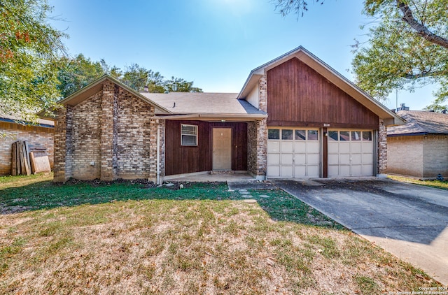 view of front of house with a front lawn and a garage