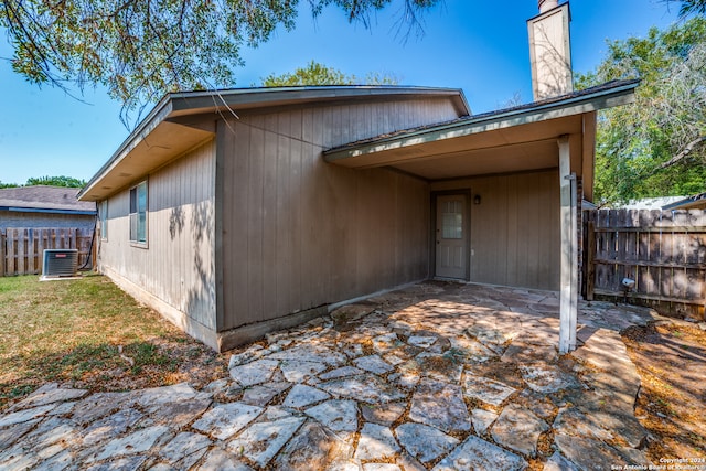 back of house with a patio area and central air condition unit