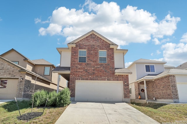 front of property with a garage