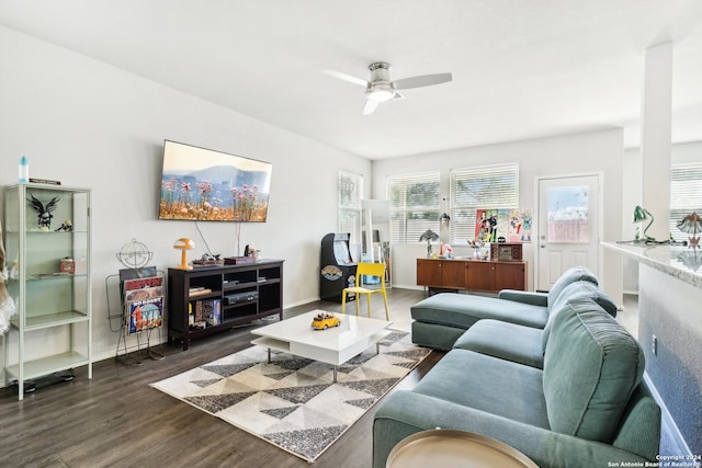 living room with dark hardwood / wood-style floors and ceiling fan