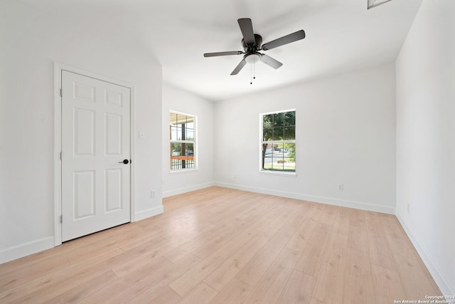 spare room with ceiling fan and light hardwood / wood-style floors