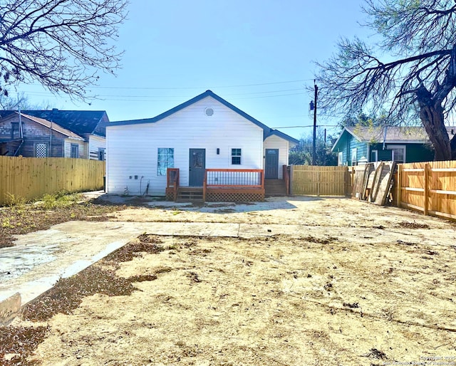 back of property featuring a deck