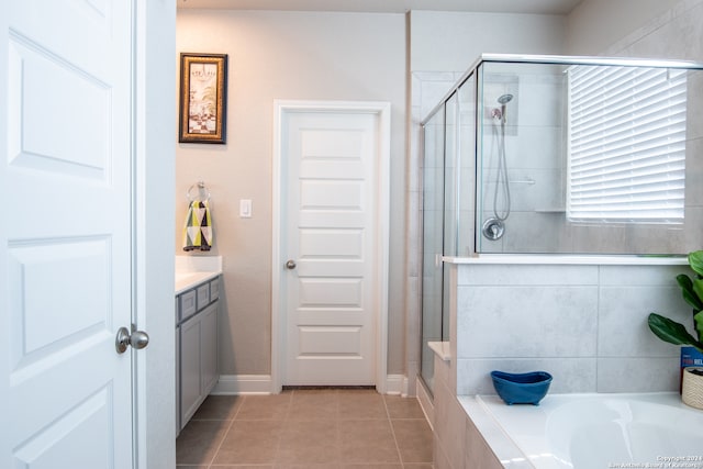 bathroom featuring separate shower and tub, tile patterned floors, and vanity