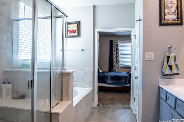 bathroom featuring vanity, separate shower and tub, and tile patterned floors