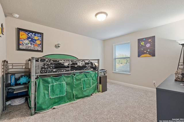 232 Wickersham, Boerne, TX 78015 - bedroom featuring carpet flooring, a textured ceiling, and baseboards