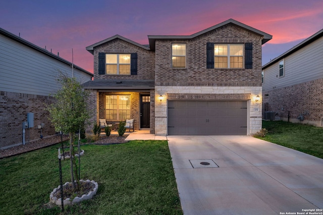 232 Wickersham, Boerne, TX 78015 - traditional home with a yard, brick siding, an attached garage, and driveway