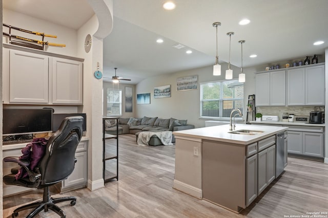 232 Wickersham, Boerne, TX 78015 - kitchen featuring a sink, light wood-style floors, gray cabinetry, and dishwasher