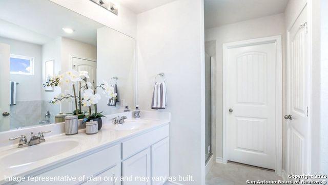 bathroom with double vanity and a sink