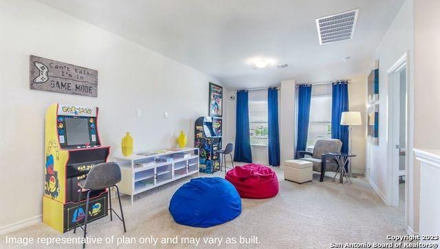 playroom with carpet floors, visible vents, and baseboards
