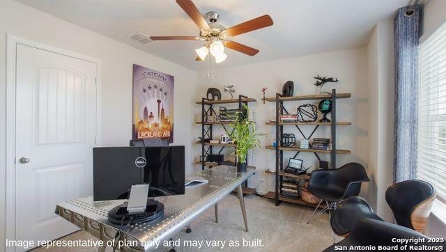 carpeted office space featuring a ceiling fan and visible vents