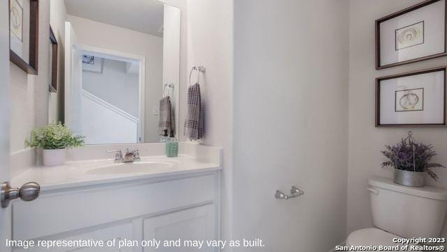 bathroom with vanity and toilet