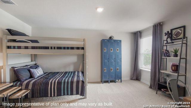 bedroom featuring visible vents, carpet flooring, and baseboards