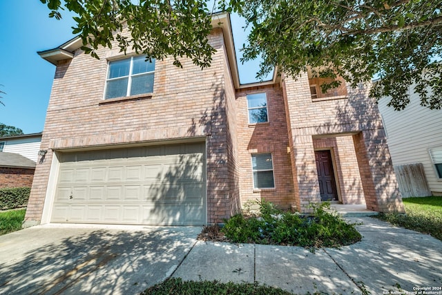 2815 Bandbury Oak, San Antonio, TX 78247 - view of front facade featuring brick siding, an attached garage, and concrete driveway