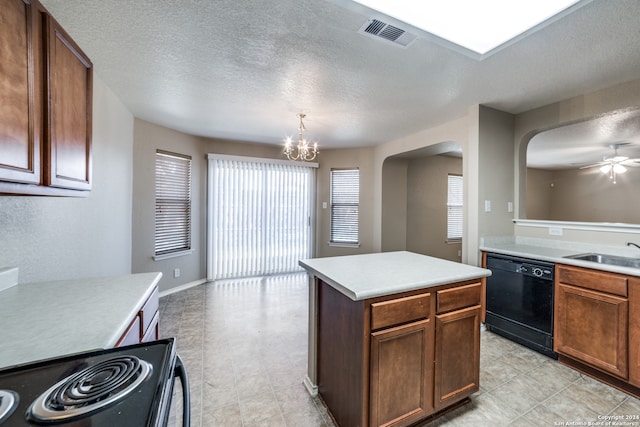 kitchen with black dishwasher, a kitchen island, range, decorative light fixtures, and sink