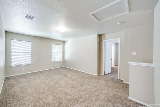 2815 Bandbury Oak, San Antonio, TX 78247 - carpeted spare room with a textured ceiling, attic access, and baseboards