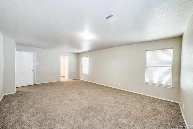 2815 Bandbury Oak, San Antonio, TX 78247 - unfurnished room featuring a textured ceiling and carpet floors