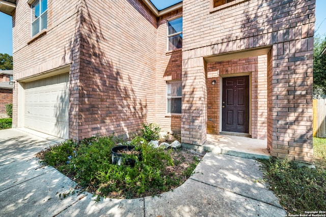 doorway to property featuring a garage