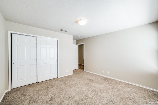 2815 Bandbury Oak, San Antonio, TX 78247 - unfurnished bedroom with a closet, baseboards, carpet flooring, and visible vents