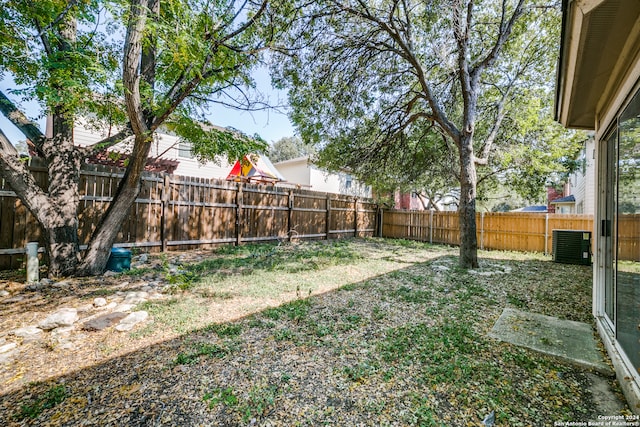 view of yard with central AC