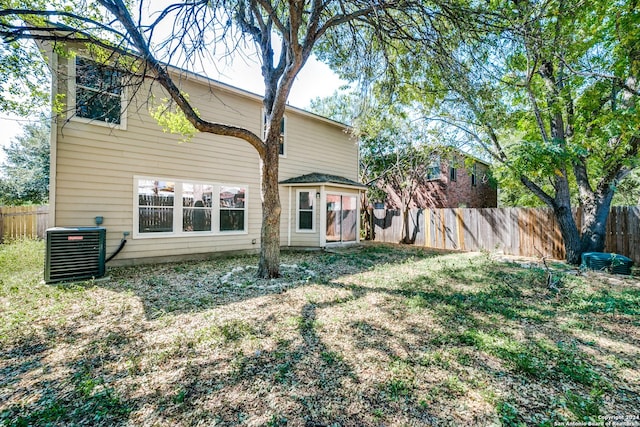 2815 Bandbury Oak, San Antonio, TX 78247 - rear view of house featuring central AC and fence