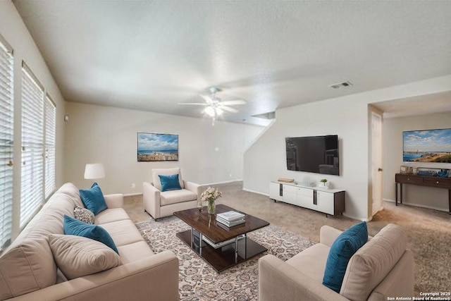 2815 Bandbury Oak, San Antonio, TX 78247 - living room with baseboards, light colored carpet, ceiling fan, and visible vents