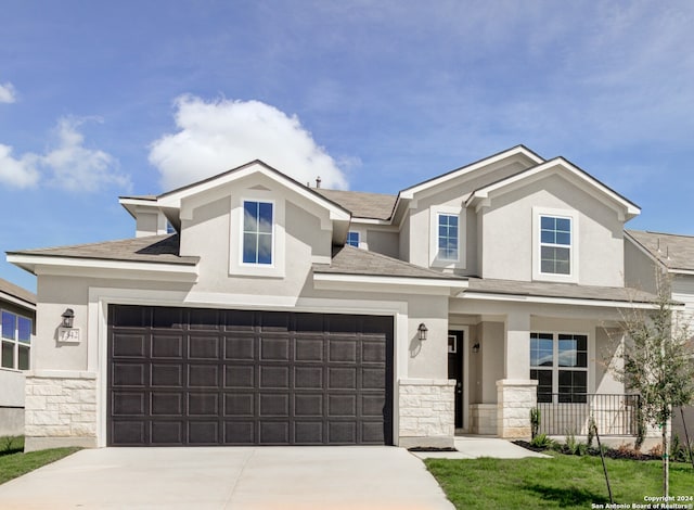 view of front of house featuring a garage and covered porch