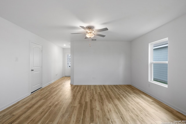 unfurnished room with ceiling fan and light hardwood / wood-style flooring