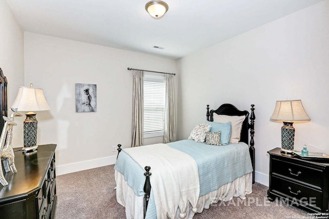 bedroom with carpet, visible vents, and baseboards