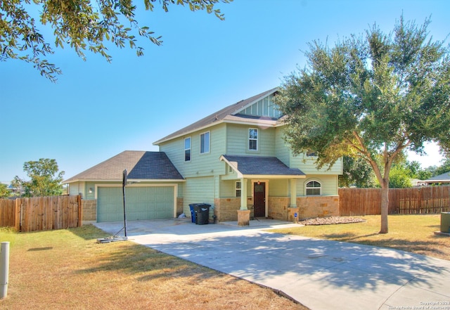 view of front of property featuring a front lawn and a garage