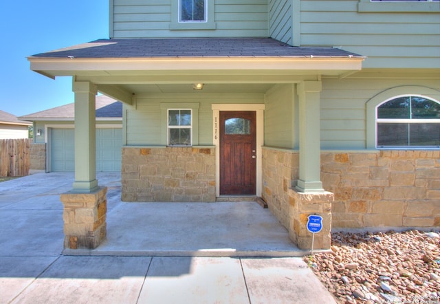 view of exterior entry featuring a garage