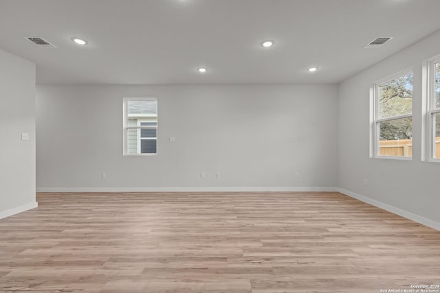 spare room featuring light hardwood / wood-style floors