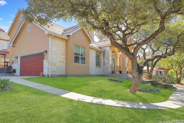 view of front facade with a front yard and a garage