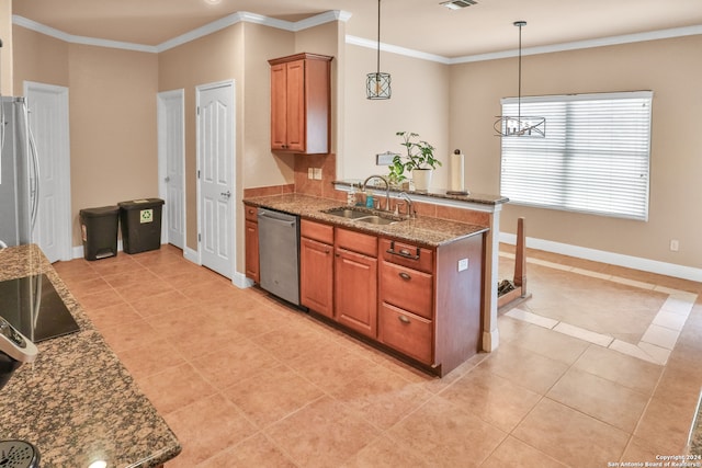 kitchen with hanging light fixtures, dark stone countertops, sink, a notable chandelier, and appliances with stainless steel finishes