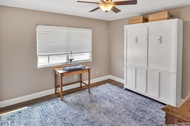 misc room featuring dark hardwood / wood-style flooring and ceiling fan