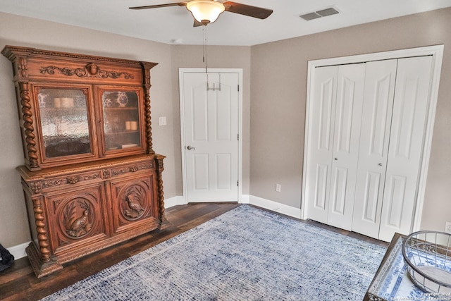 bedroom featuring dark wood-type flooring and ceiling fan