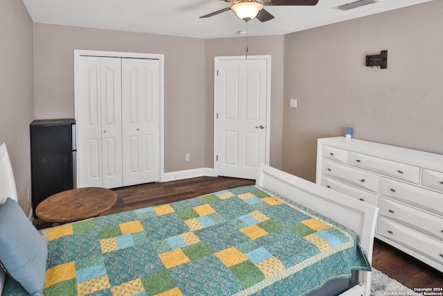 bedroom featuring dark hardwood / wood-style flooring, a closet, and ceiling fan