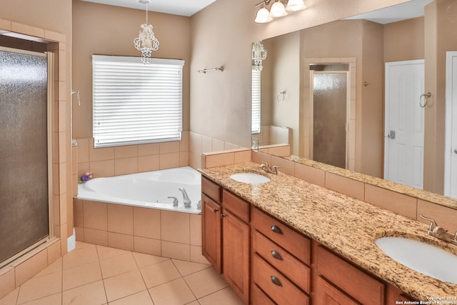 bathroom featuring vanity, independent shower and bath, and tile patterned floors