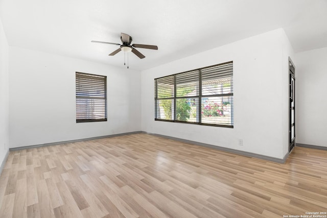 214 Oriole, San Antonio, TX 78228 - empty room with light wood-style floors, a ceiling fan, and baseboards
