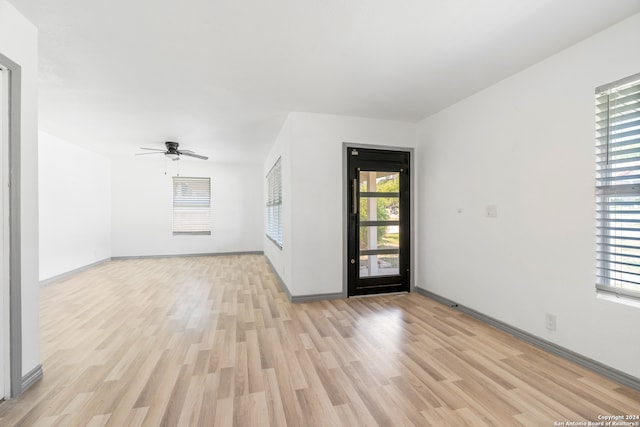 empty room featuring light hardwood / wood-style floors and ceiling fan