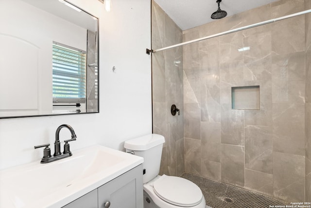214 Oriole, San Antonio, TX 78228 - bathroom featuring vanity, a tile shower, and toilet