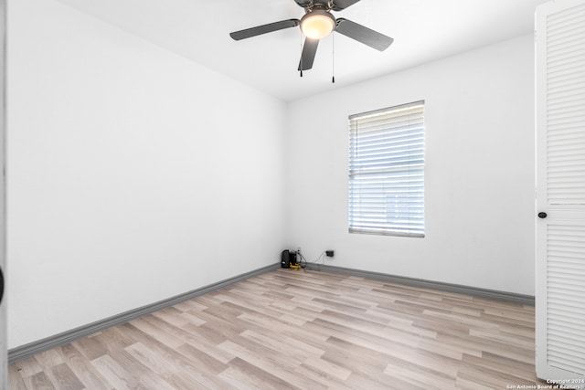 spare room with ceiling fan and light hardwood / wood-style floors