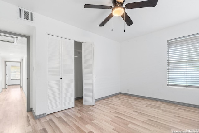 214 Oriole, San Antonio, TX 78228 - unfurnished bedroom with ceiling fan, baseboards, light wood-type flooring, visible vents, and a closet