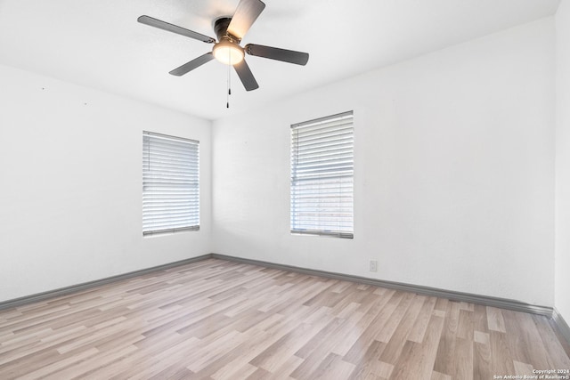 214 Oriole, San Antonio, TX 78228 - empty room featuring light wood-style floors, baseboards, and ceiling fan