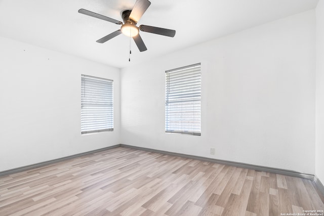 unfurnished room with ceiling fan and light hardwood / wood-style flooring