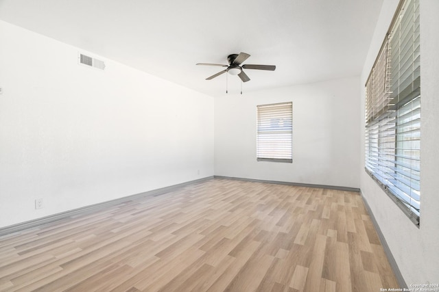 214 Oriole, San Antonio, TX 78228 - empty room with baseboards, ceiling fan, light wood finished floors, and visible vents