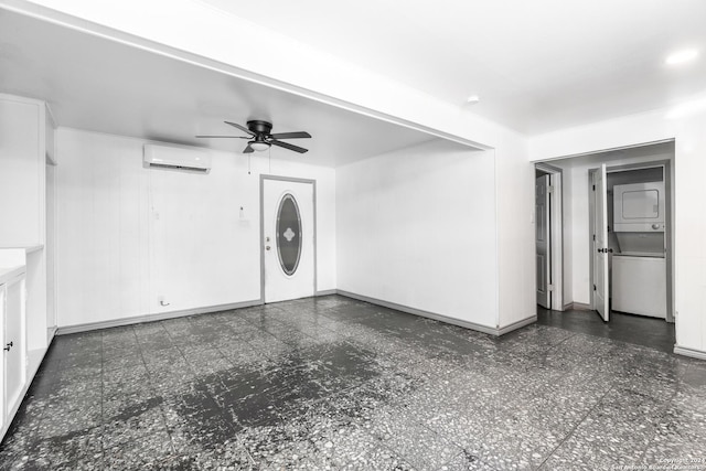 214 Oriole, San Antonio, TX 78228 - unfurnished living room featuring baseboards, a ceiling fan, a wall unit AC, and stacked washer / drying machine